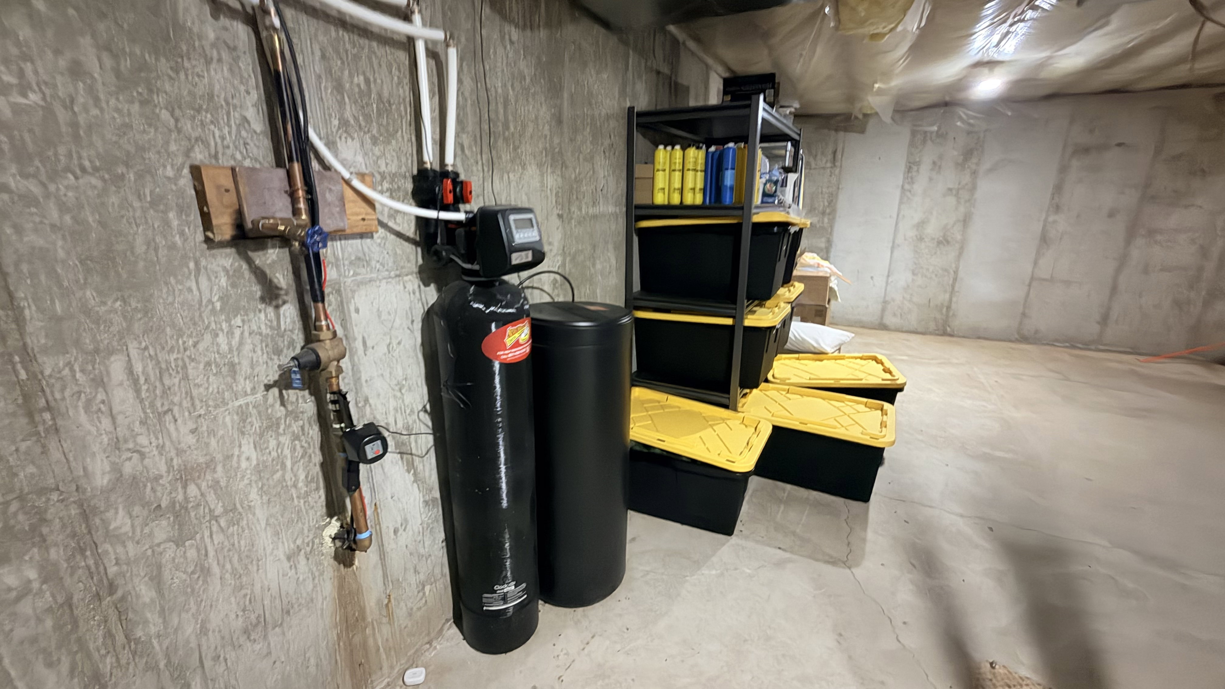 Unfinished below grade area with a water softener system