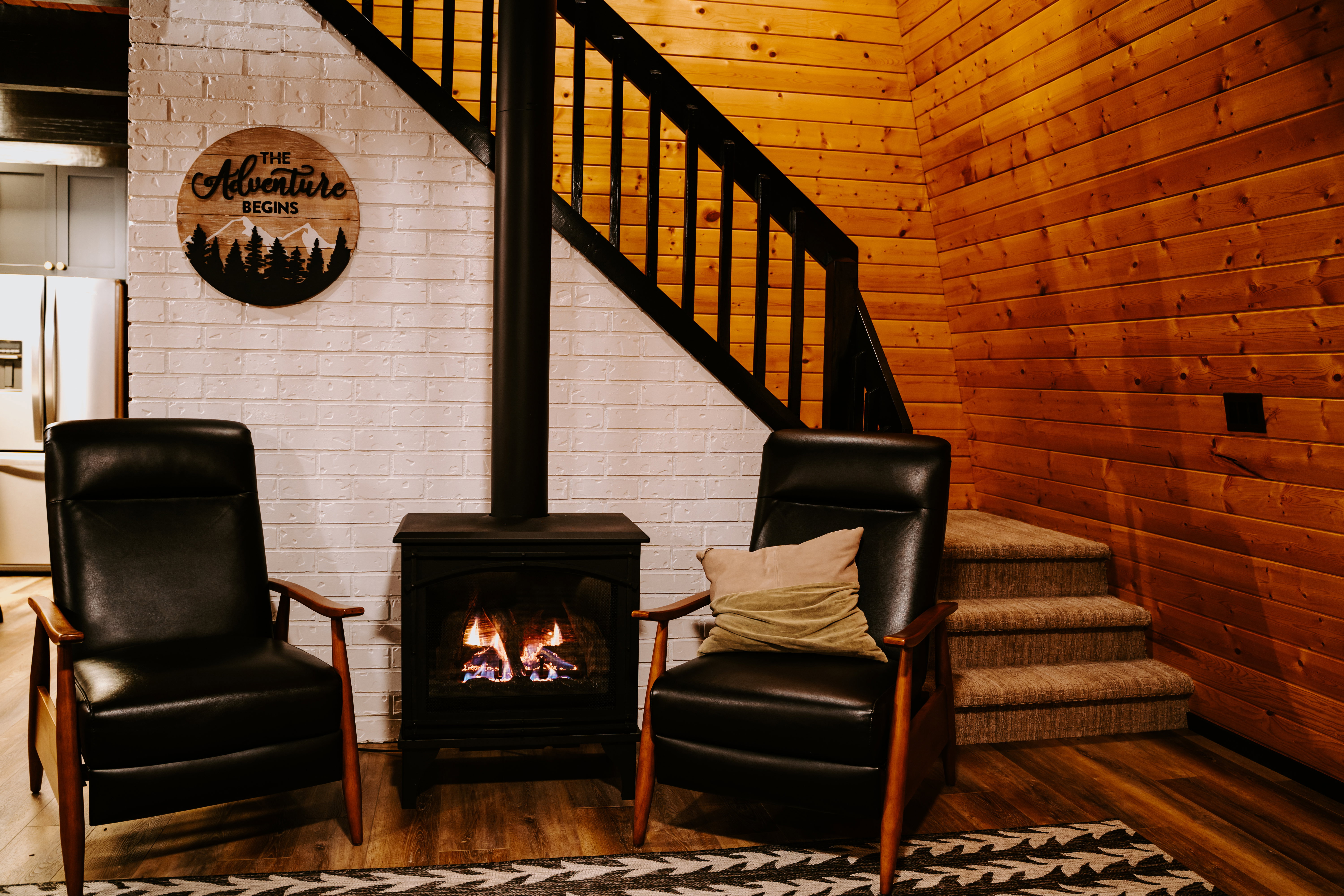 Sitting room with stairway and wood finished floors
