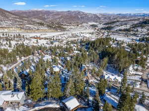 Snowy aerial view featuring a mountain view