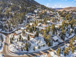 Snowy aerial view featuring a mountain view