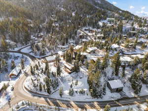 Snowy aerial view with a residential view and a mountain view
