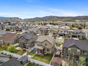 Aerial view of residential area featuring a mountain backdrop