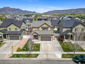 Traditional-style home featuring a mountain view, stucco siding, and a gate