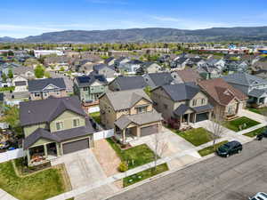 Aerial view of residential area featuring a mountainous background