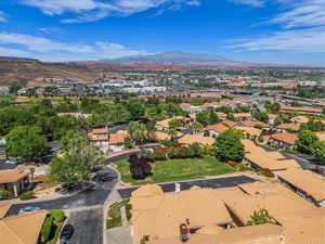 Aerial perspective of suburban area featuring a mountainous background