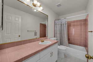 Full bathroom with vanity and shower / tub combo