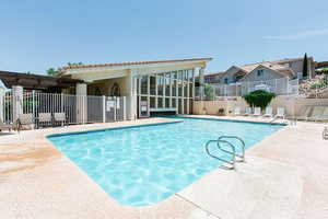 Community pool with a patio area