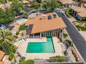 Community pool featuring a residential view and a patio