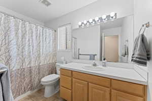 Full bathroom with vanity, a shower with curtain, and light tile patterned floors