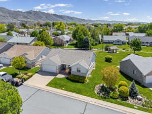 Aerial perspective of suburban area featuring a mountain backdrop