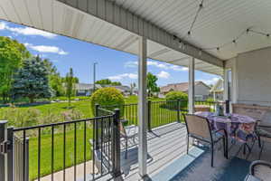 Deck featuring a lawn and a residential view
