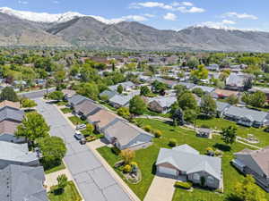 Aerial view of residential area featuring a mountain backdrop