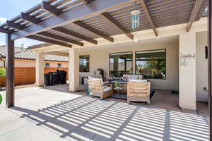 View of patio with a pergola and outdoor seating