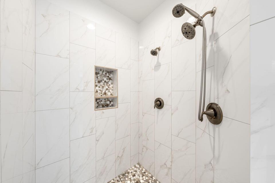 Full bathroom with a tile shower