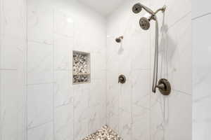 Full bathroom with a tile shower