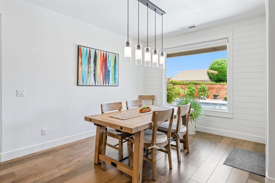 Dining space featuring hardwood / wood-style flooring and baseboards