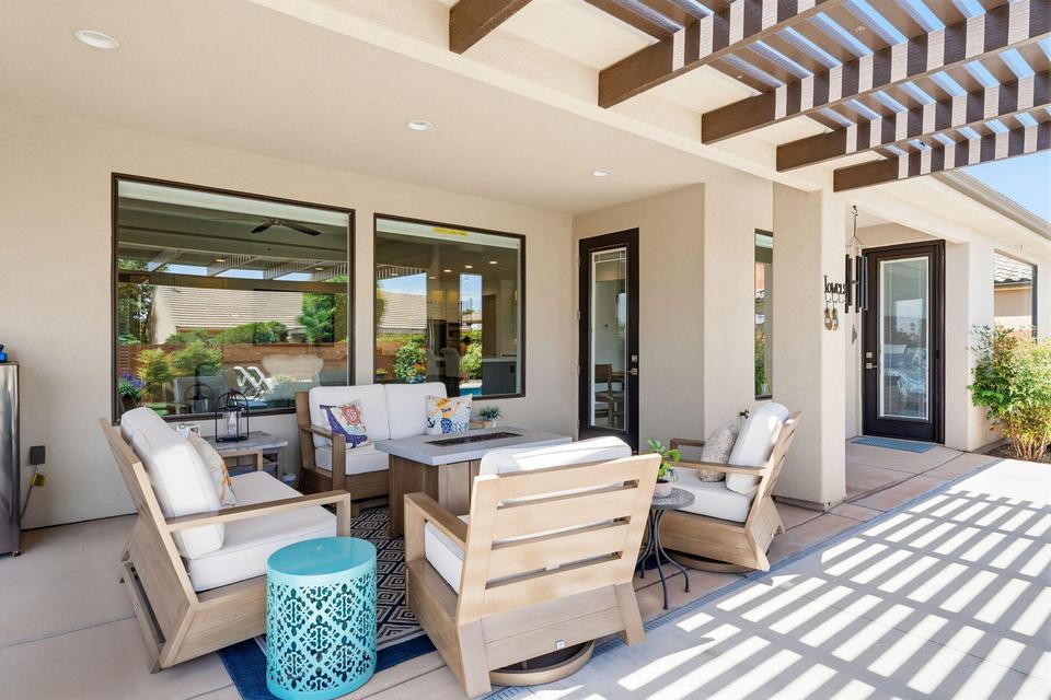 View of patio with an outdoor living space and a pergola