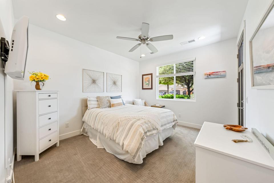 Bedroom featuring light carpet, a ceiling fan, and recessed lighting