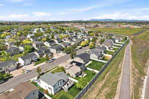 Aerial perspective of suburban area featuring a mountain backdrop