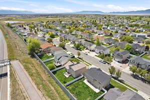 Aerial perspective of suburban area featuring a mountainous background