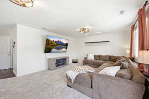Living area with carpet floors and baseboards