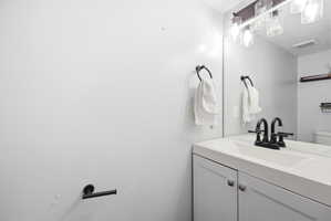 Bathroom with vanity and toilet