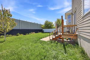 Fenced yard with a patio area