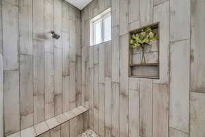 Bathroom featuring a tile shower