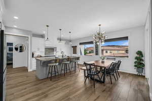 Dining room featuring a chandelier and dark wood finished floors