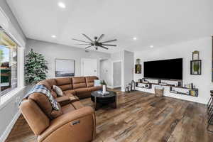 Living room featuring wood finished floors, ceiling fan, and recessed lighting