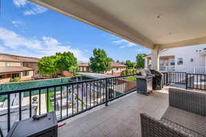 Balcony featuring a residential view and a grill