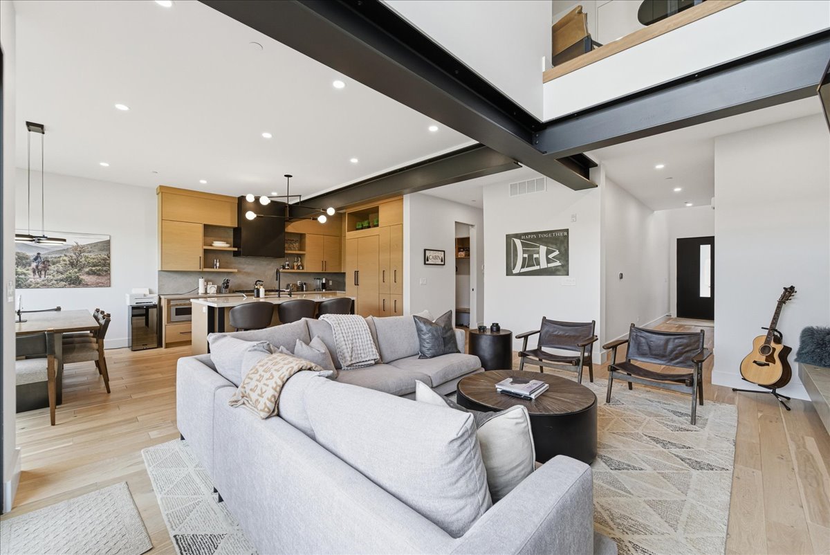 Living area with recessed lighting and light wood-style floors