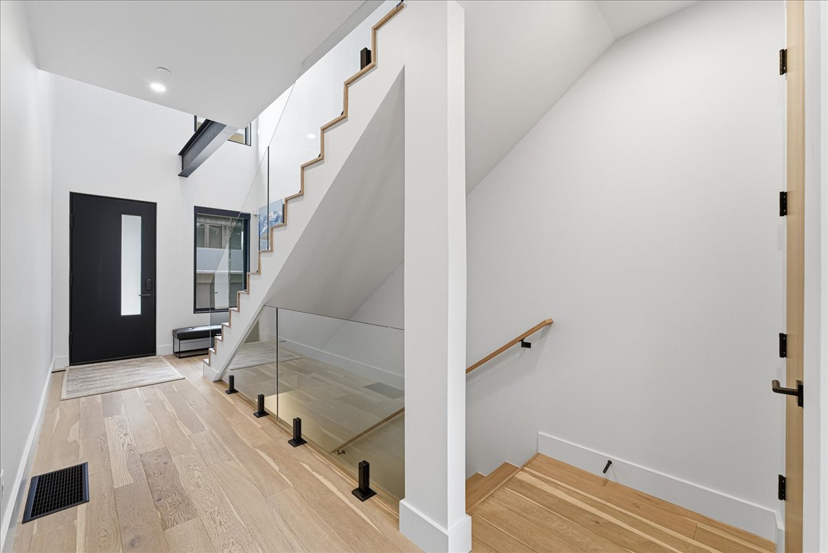 Foyer entrance featuring stairs and light wood finished floors