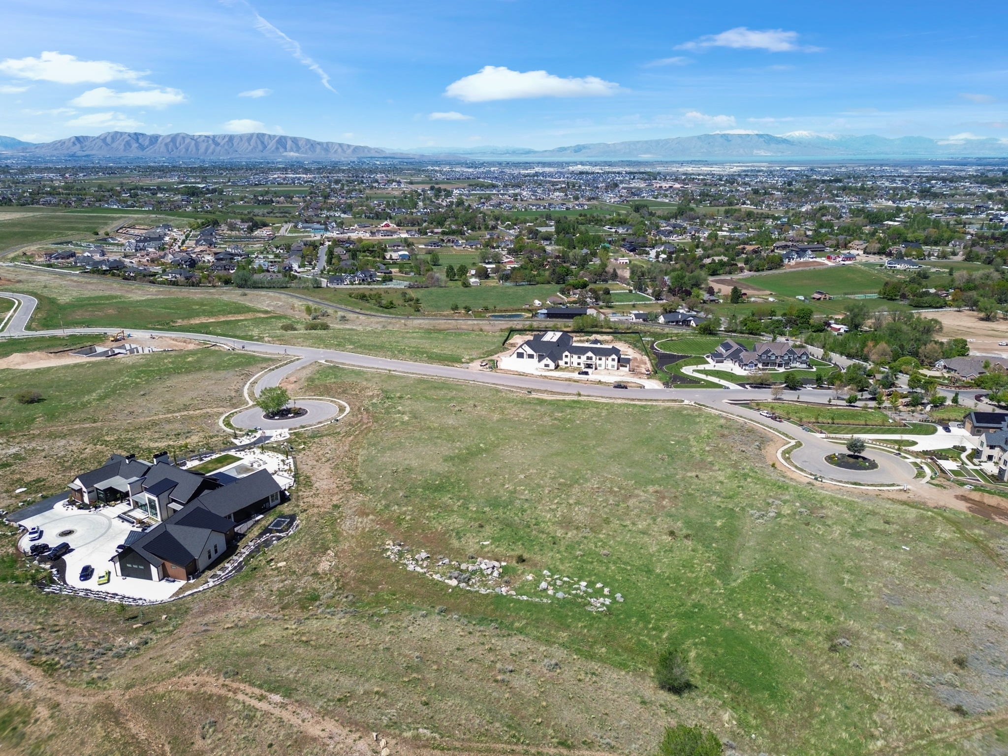 Aerial perspective of suburban area featuring a mountain backdrop