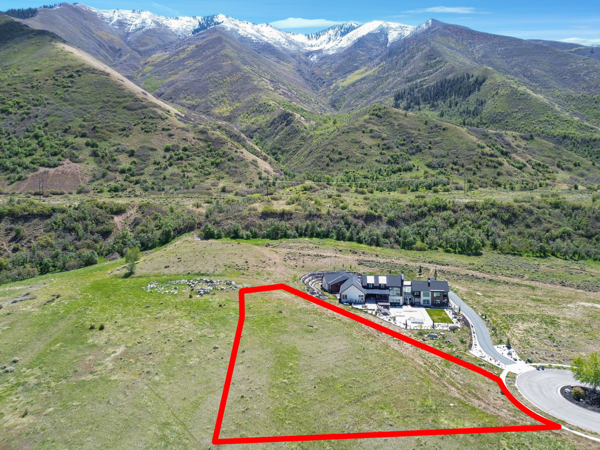View of rural area with property boundaries highlighted and a mountain backdrop