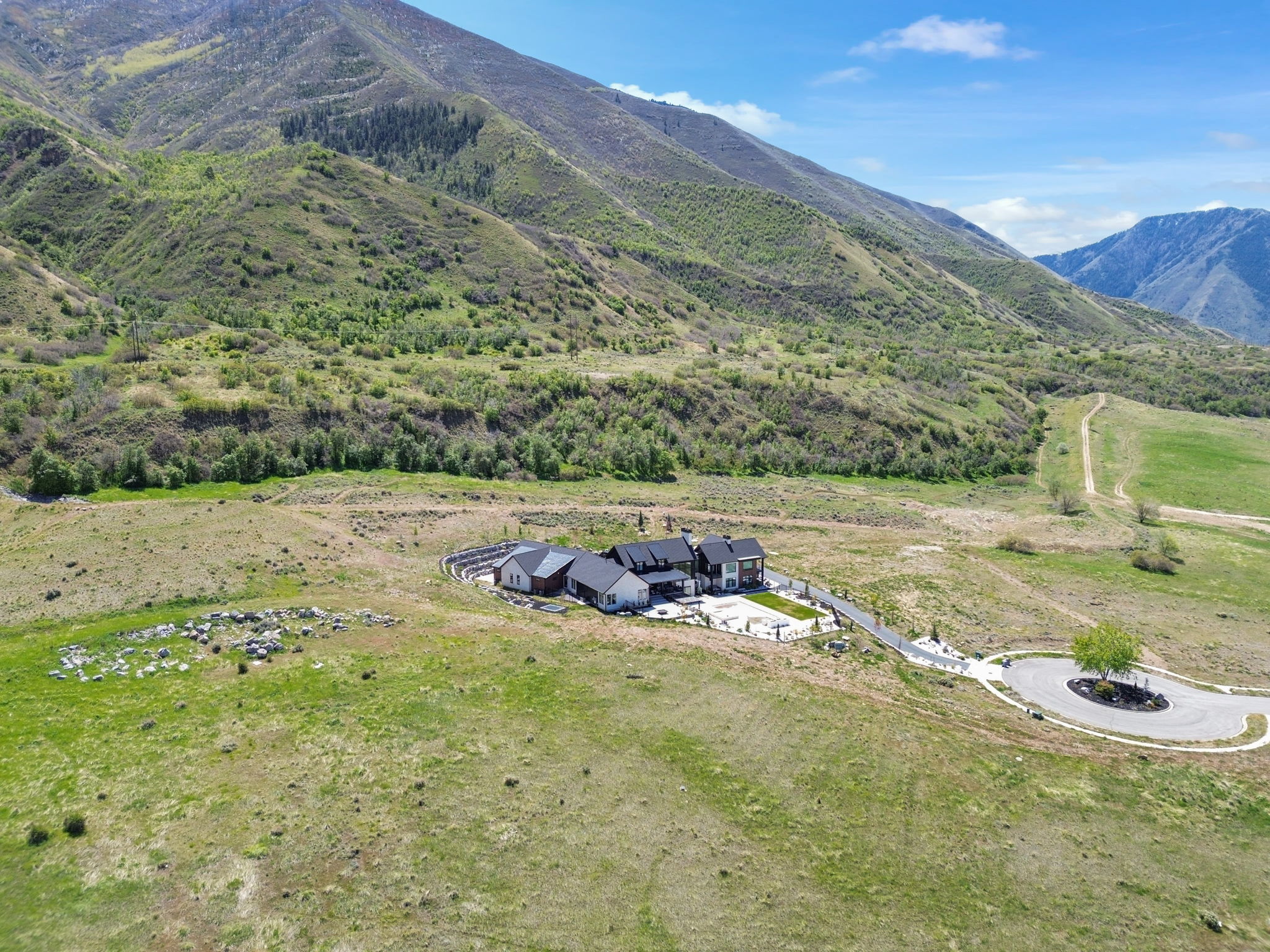 View of mountain backdrop featuring rural landscape