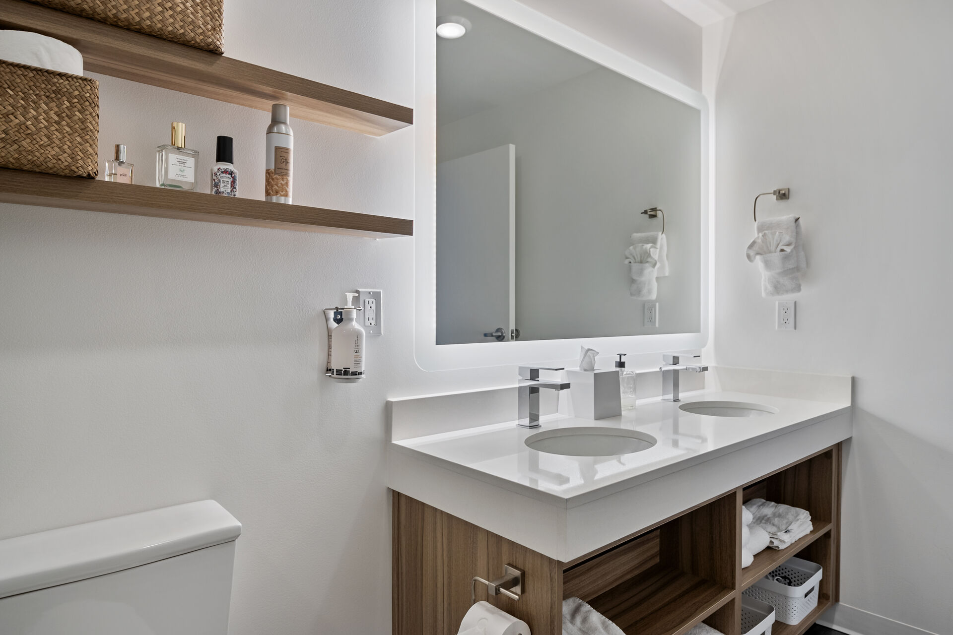 Full bathroom with double vanity and toilet