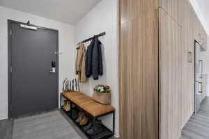 Mudroom featuring light wood finished floors