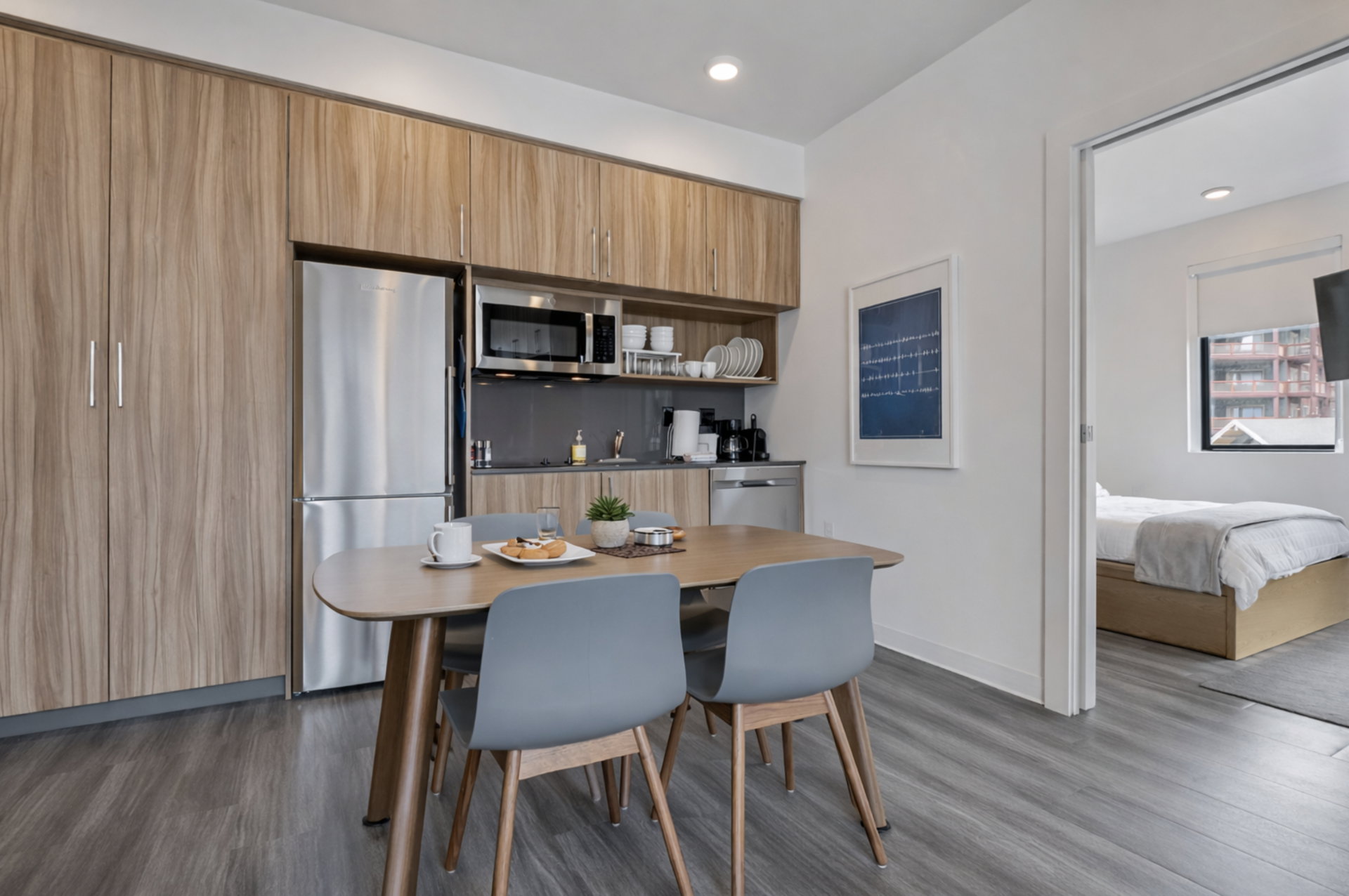 Dining area featuring dark wood-style floors and recessed lighting
