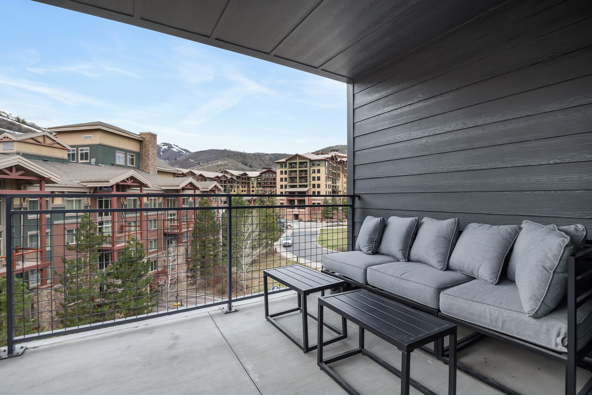 Balcony featuring a mountain view and outdoor seating