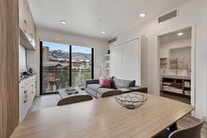 Dining room with recessed lighting and light wood-style floors