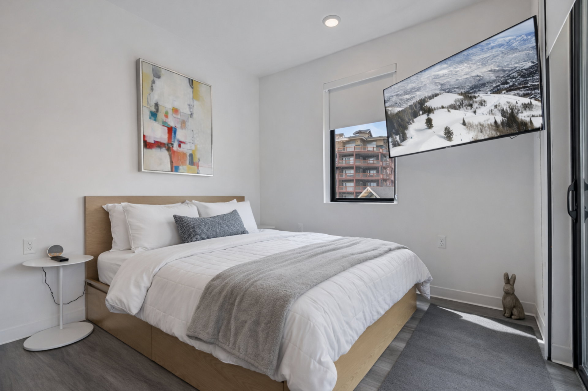 Bedroom featuring dark wood-style floors and baseboards