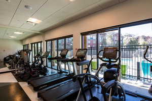 Workout area featuring a drop ceiling