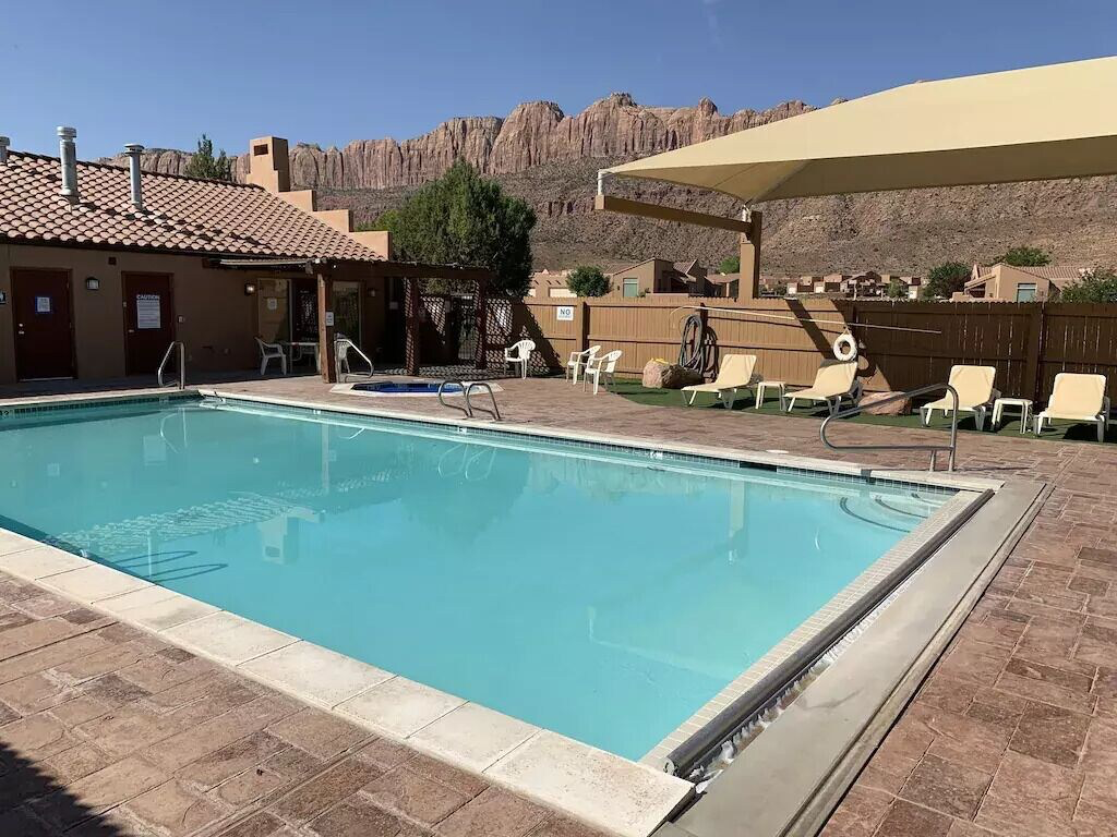 Community pool featuring a patio area, a pergola, and a mountain view