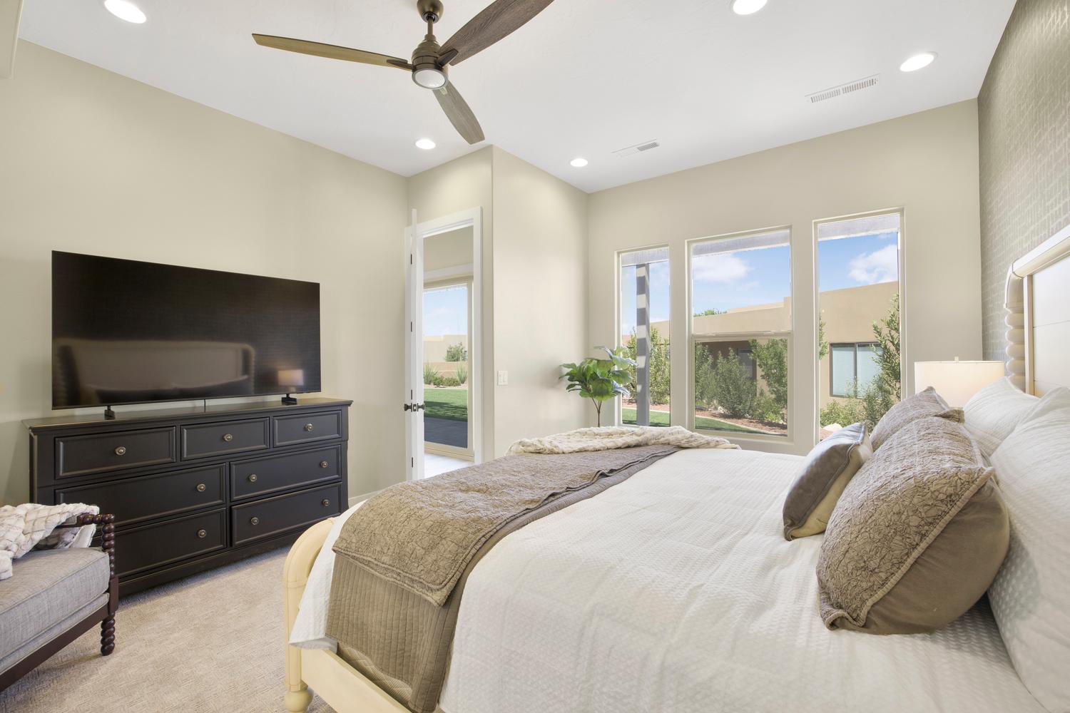 Bedroom featuring access to exterior, light carpet, recessed lighting, and ceiling fan