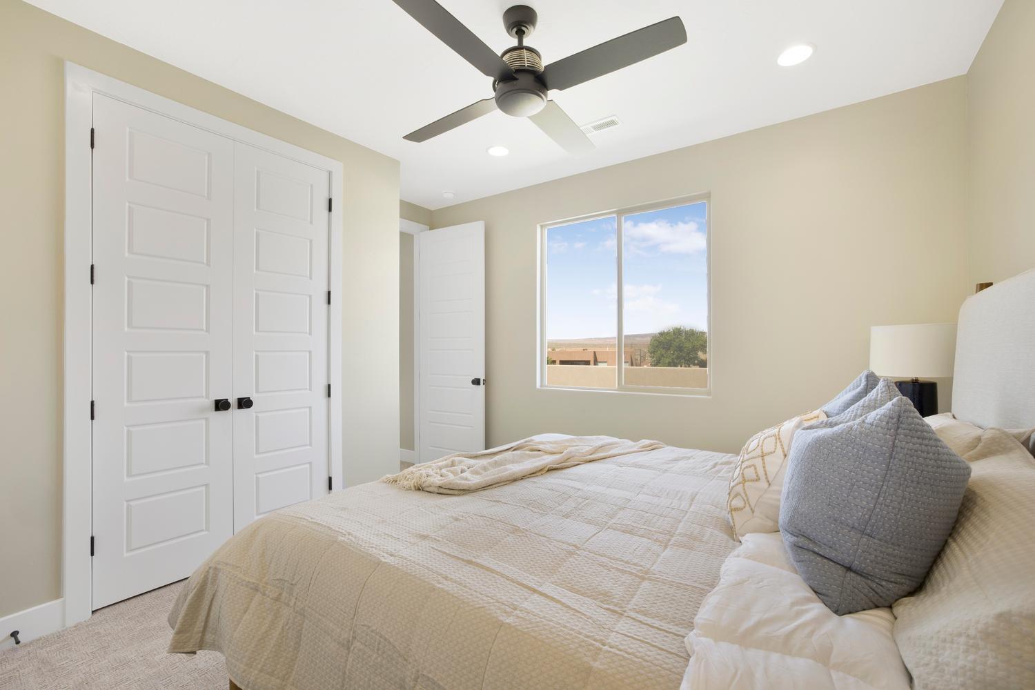 Carpeted bedroom featuring a closet, recessed lighting, and a ceiling fan