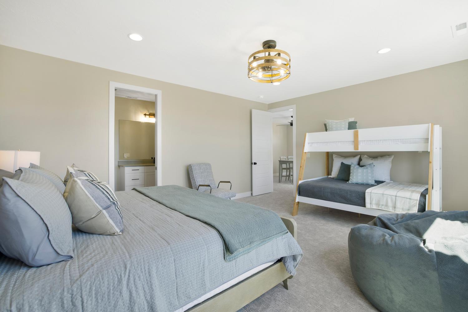 Bedroom featuring carpet flooring, recessed lighting, and connected bathroom