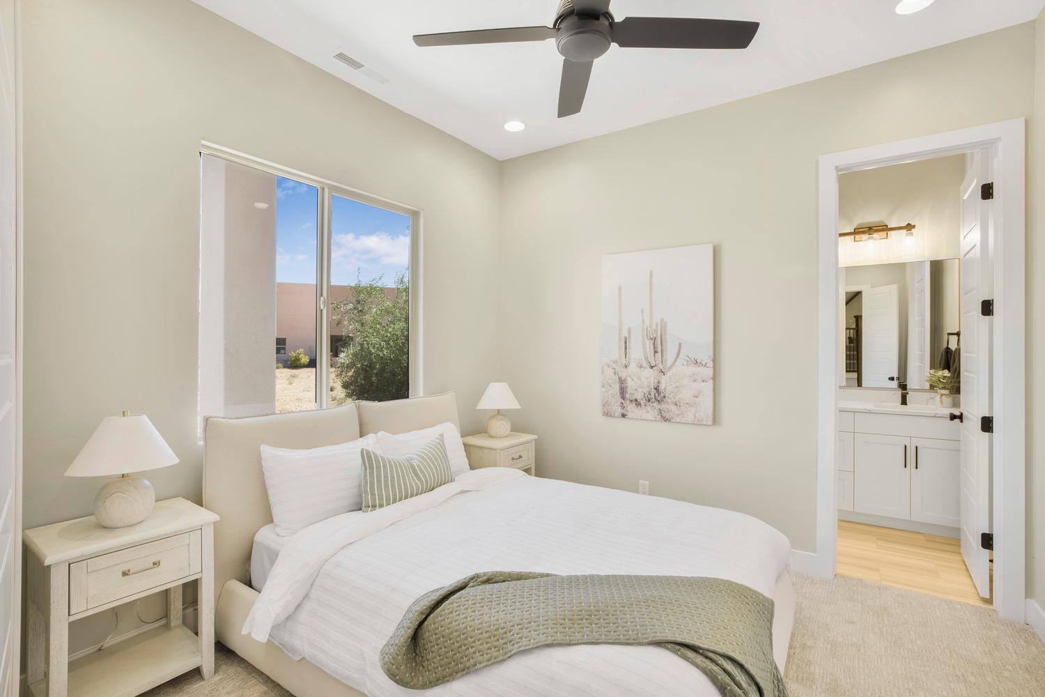 Bedroom featuring light colored carpet, a ceiling fan, and recessed lighting