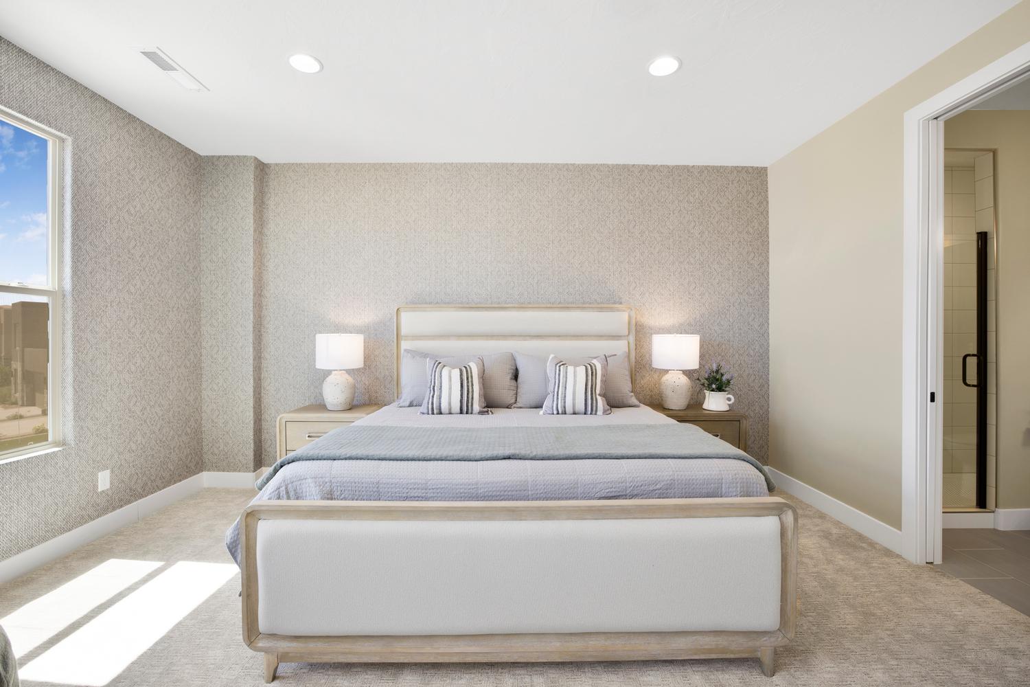 Bedroom with light carpet, recessed lighting, ensuite bath, and wallpapered walls