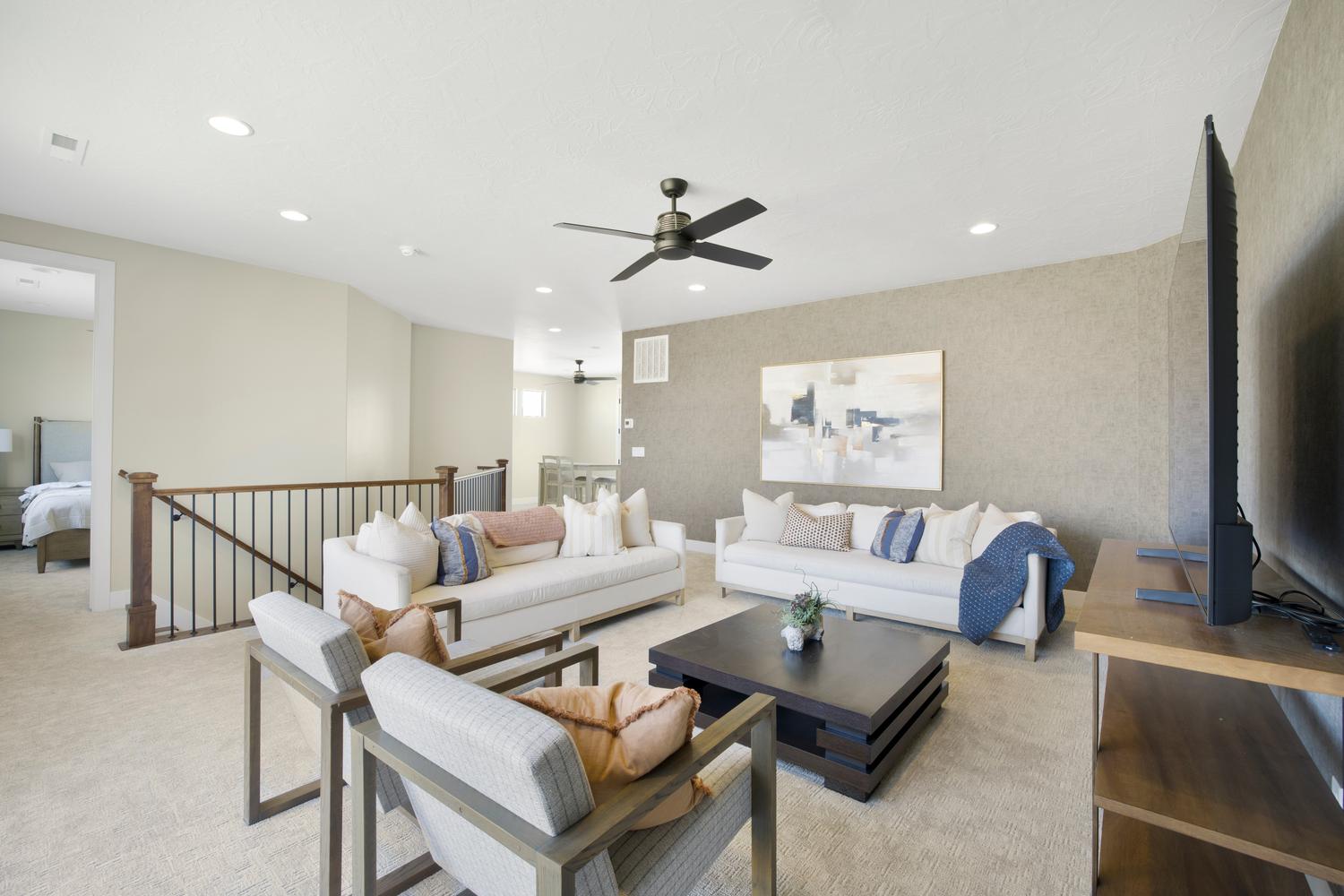 Living room with recessed lighting and ceiling fan
